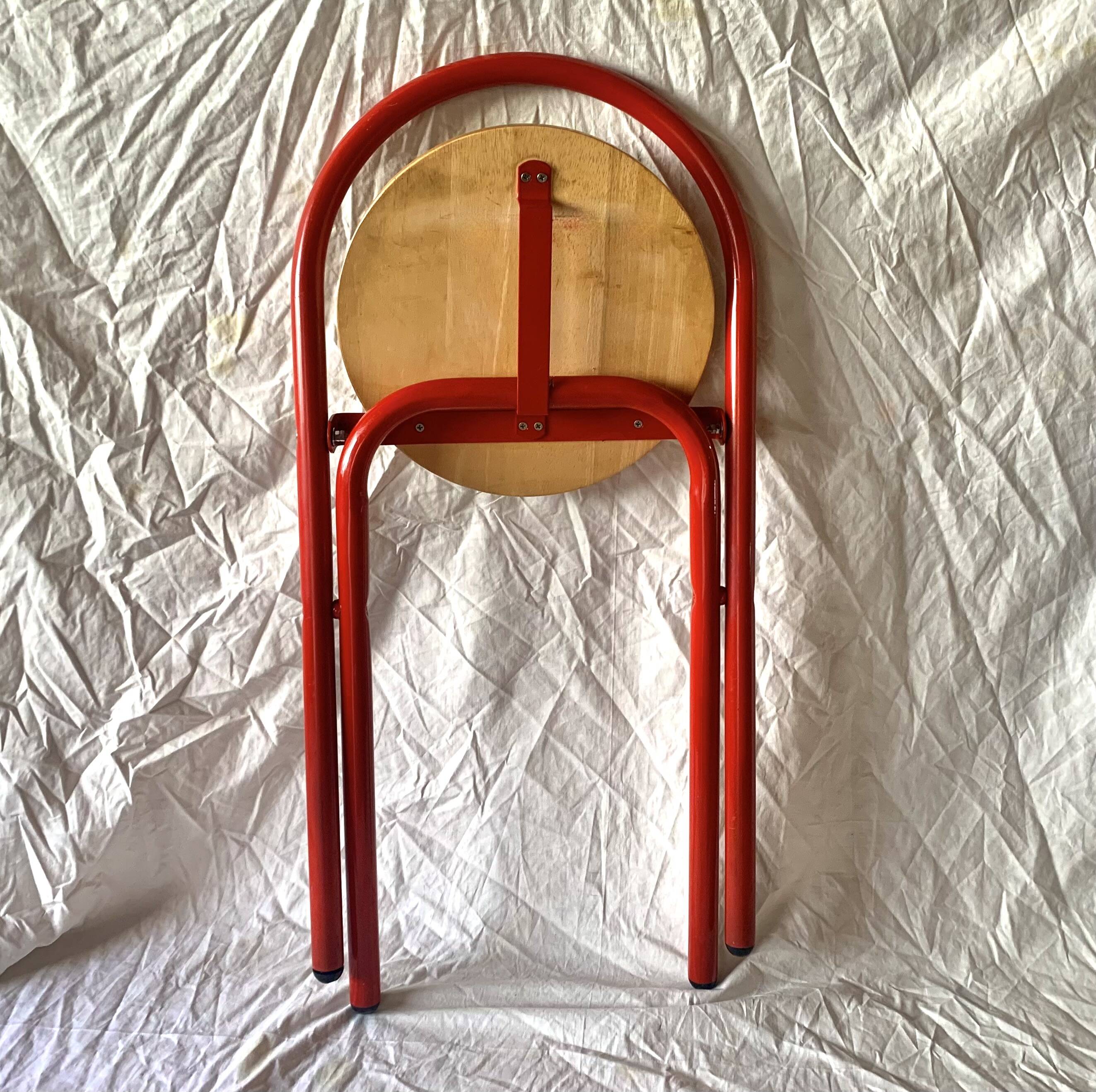 Vintage folding chair in red painted metal and wood