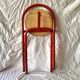 Vintage folding chair in red painted metal and wood