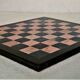 Small chessboard in coral marble and black marble - Italy - Second half of the twentieth century