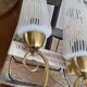 Pair of antique wall sconces brass tulip white striped glass
