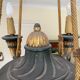 Empire style chandelier with four lights in sheet metal, bronze with patina and gilding