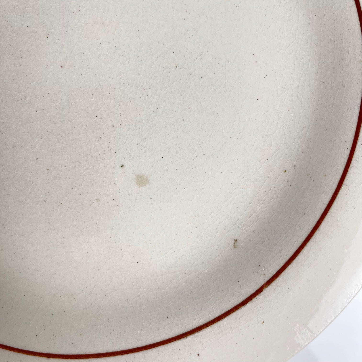 Set of 10 flat plates Longwy, 20th century, floral decoration.