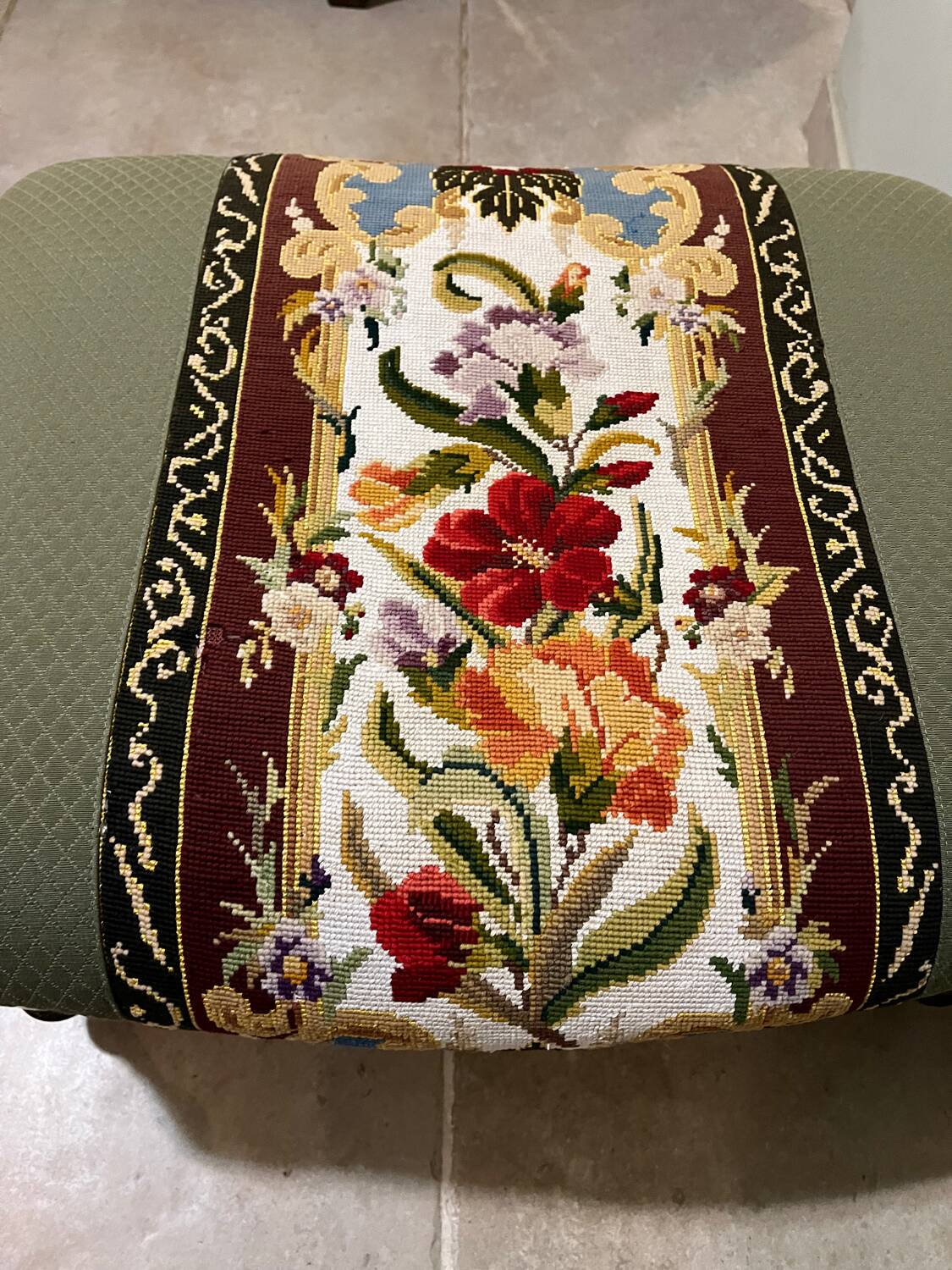 Vintage upholstered footstool, floral decor in Aubusson style.