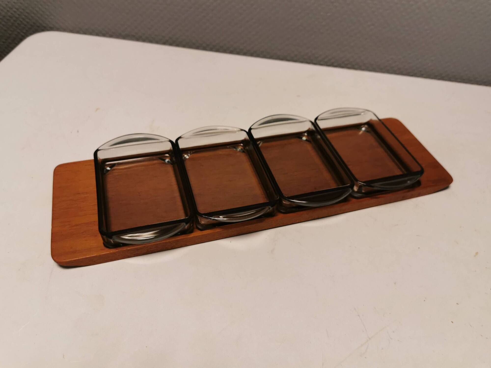 Teak Cabaret tray with four smoke coloured glass bowls, Danish and produced by Wiggers 1970s.