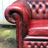 Pair of red leather chesterfield chairs