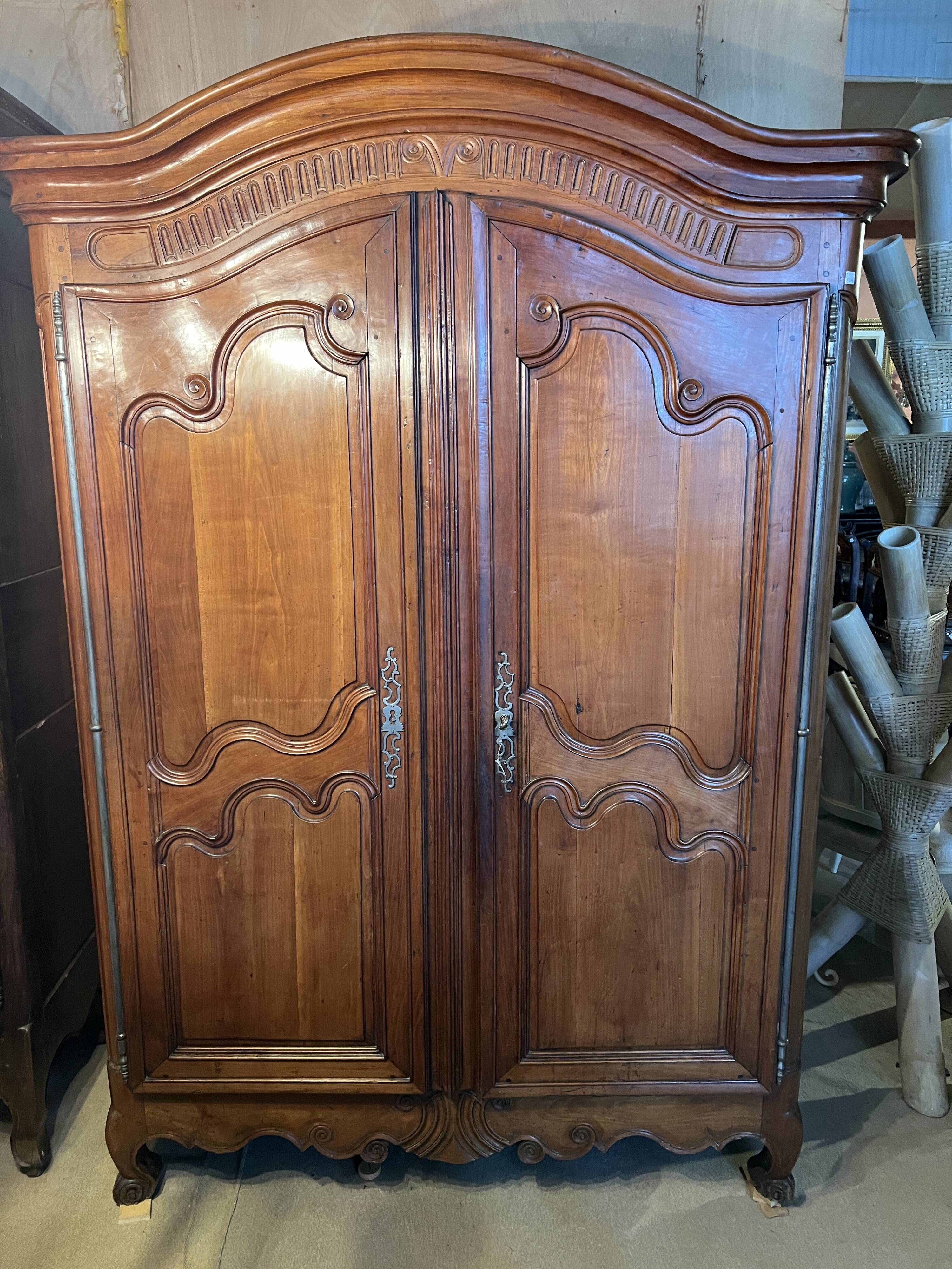 Louis XV wardrobe with two doors, Cherry wood. 18th century.