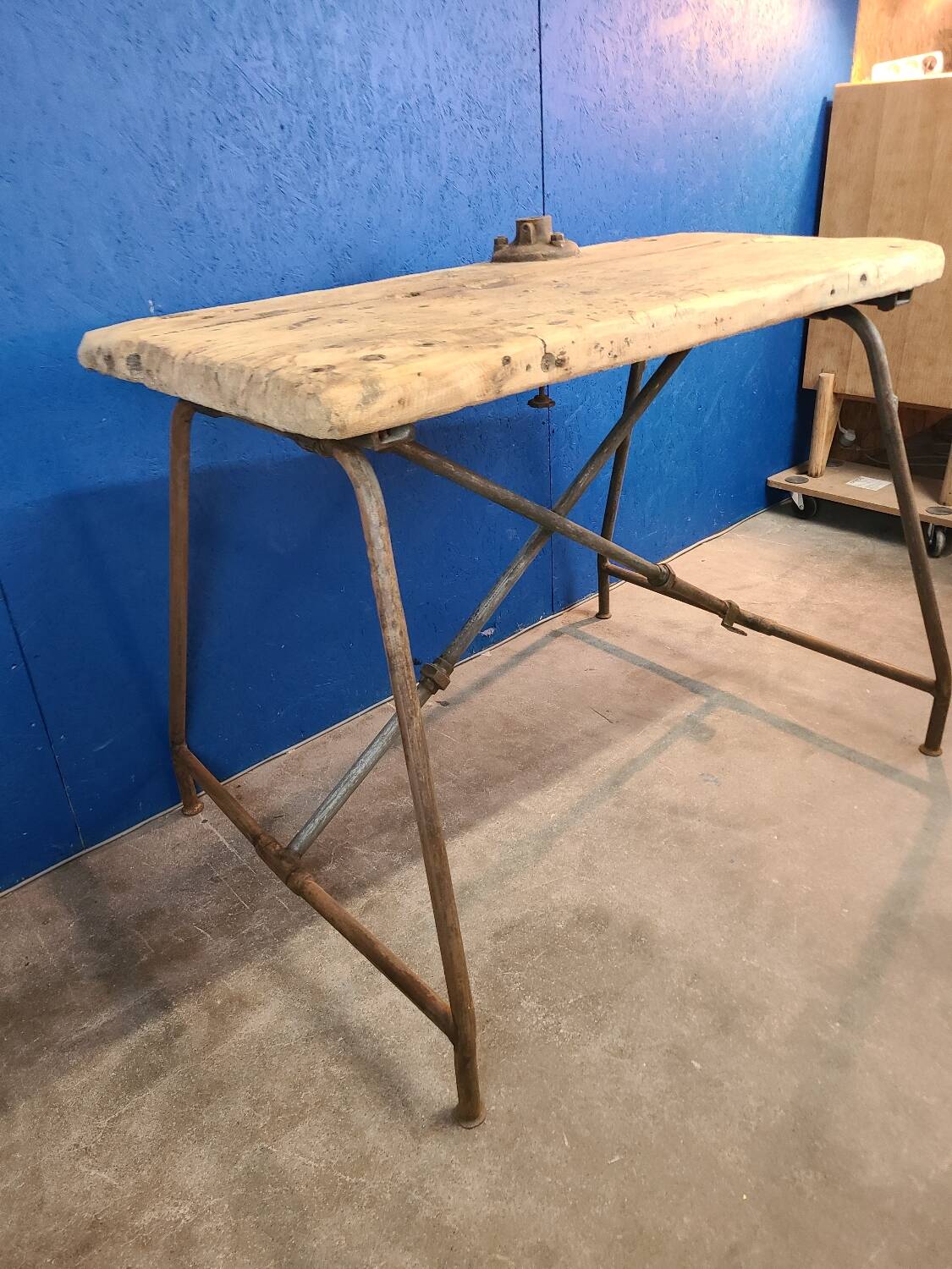Vintage workbench circa 1930, folding metal leg.