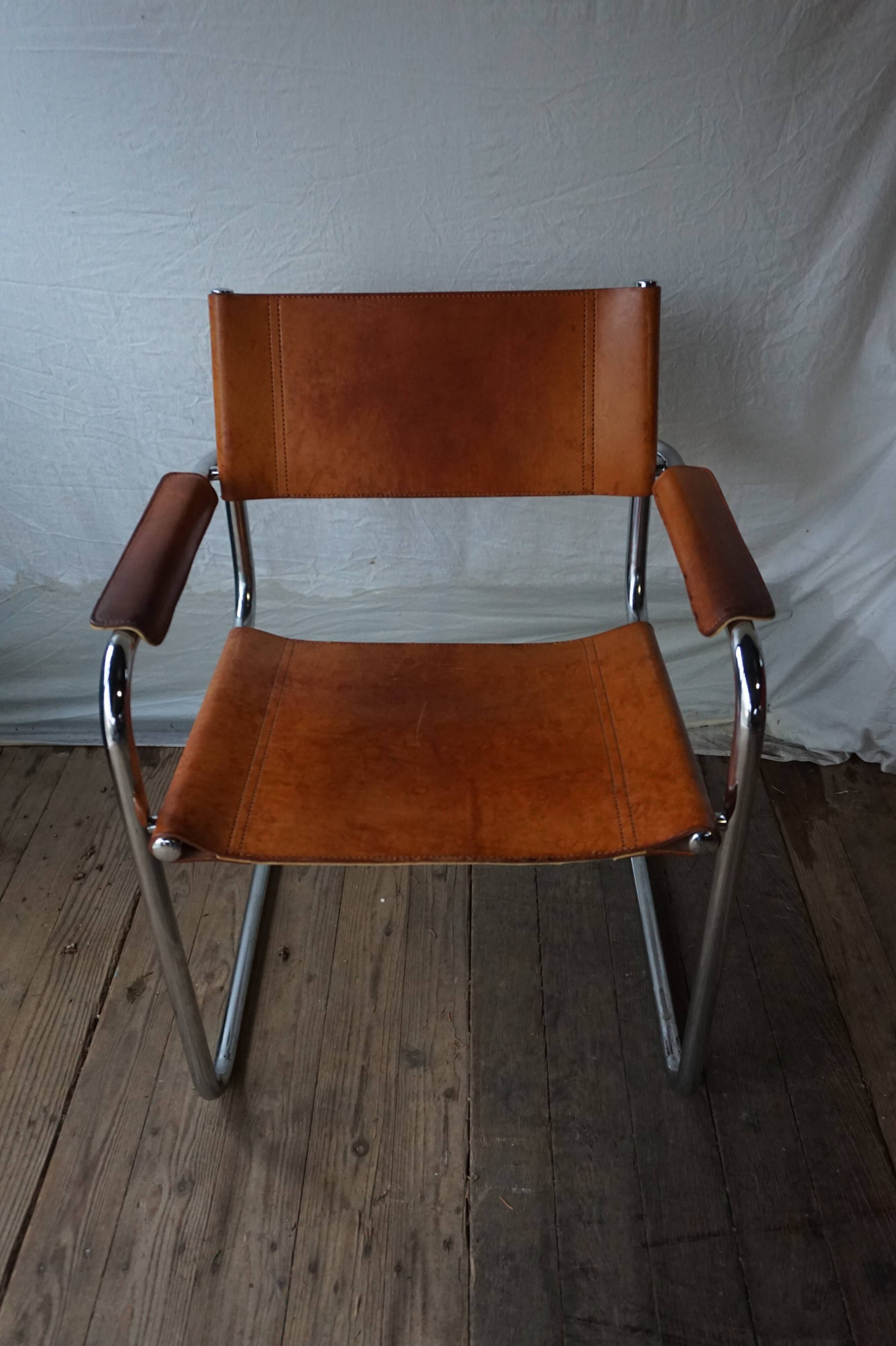 Three  leather armchairs