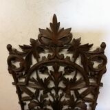 Carved wooden wall shelf