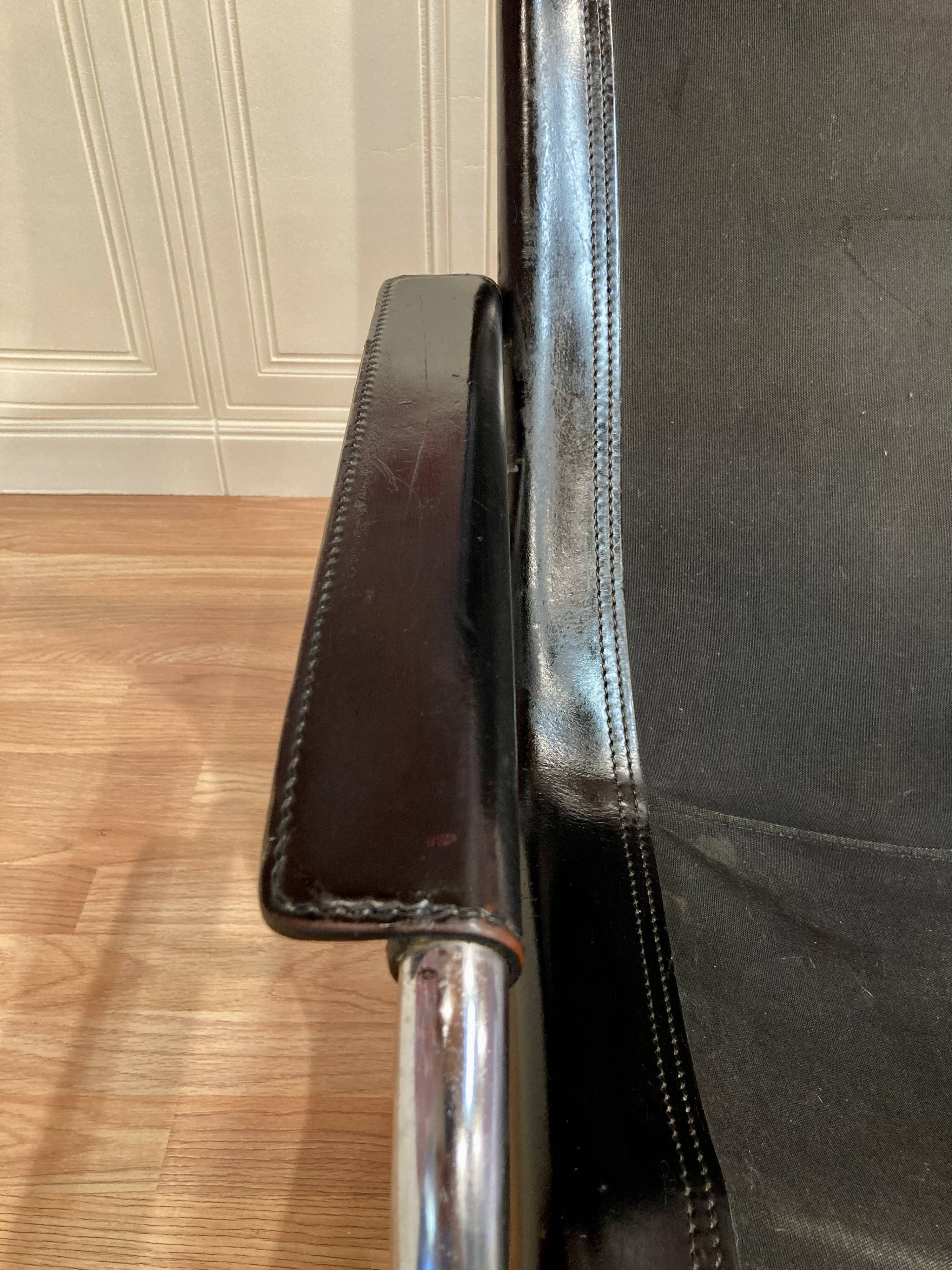 Black leather reclining lounge chair, "Hans Eichenberger" design, 1960.