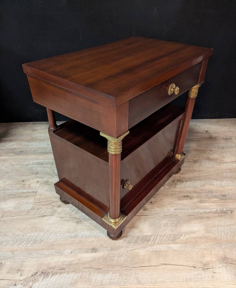 Pair of Empire style bedside tables in mahogany and gilded bronze