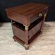 Pair of Empire style bedside tables in mahogany and gilded bronze