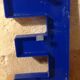 Letter E vintage sign in blue plexiglass