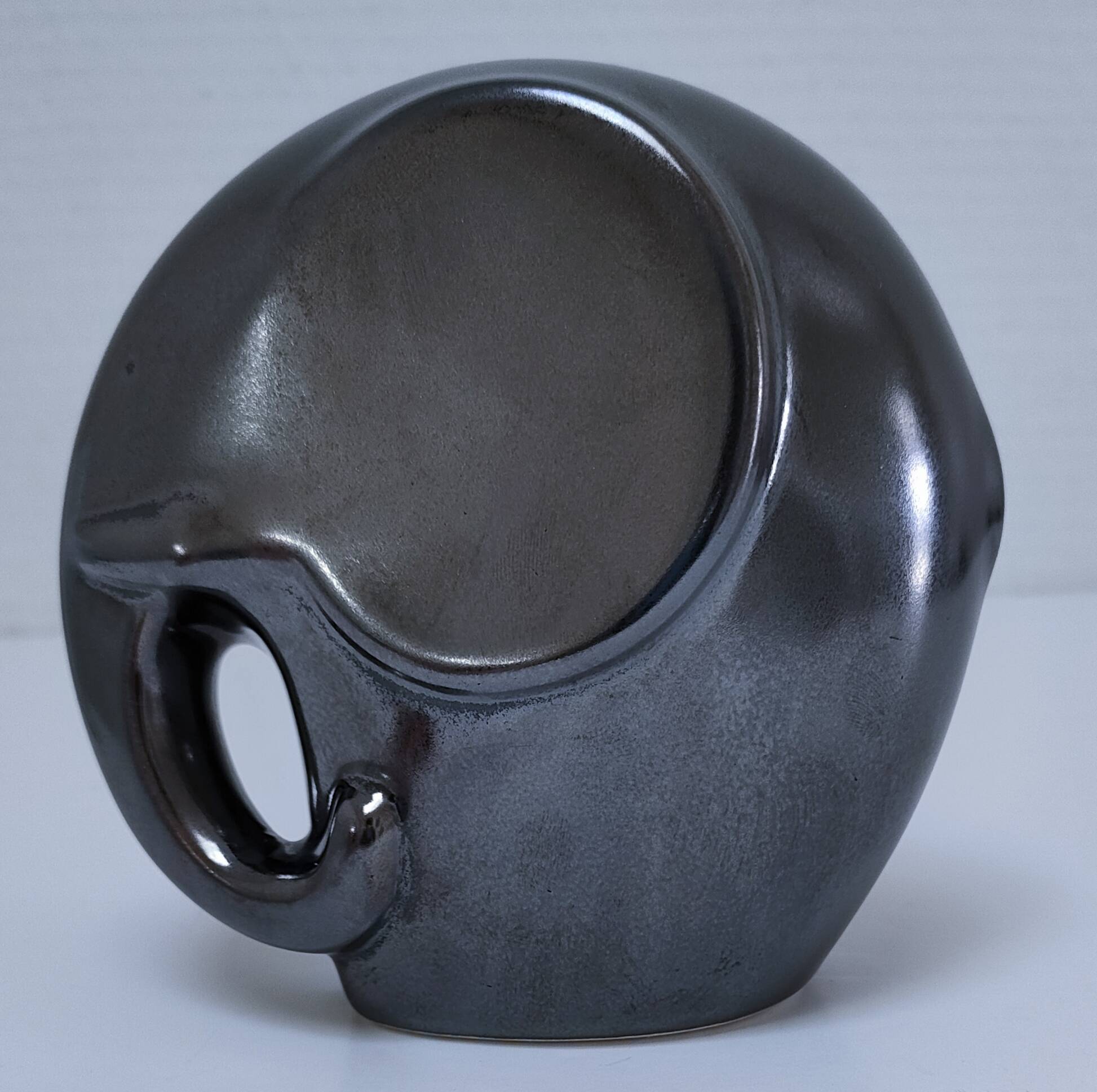 Two iridescent black and white ceramic elephants design