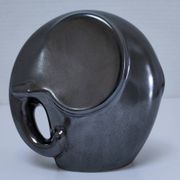 Two iridescent black and white ceramic elephants design