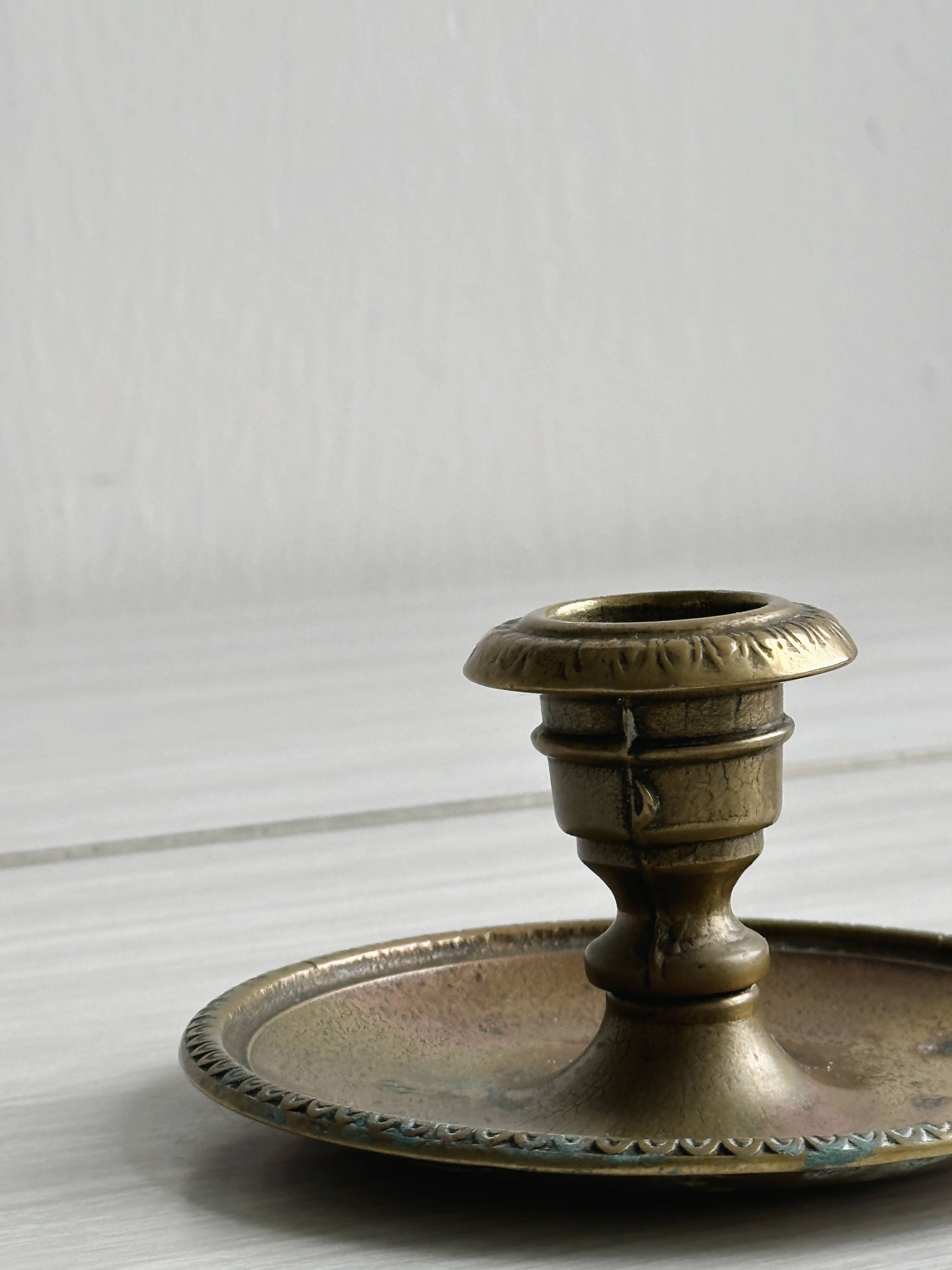 Brass candle holder with handle.