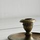 Brass candle holder with handle.