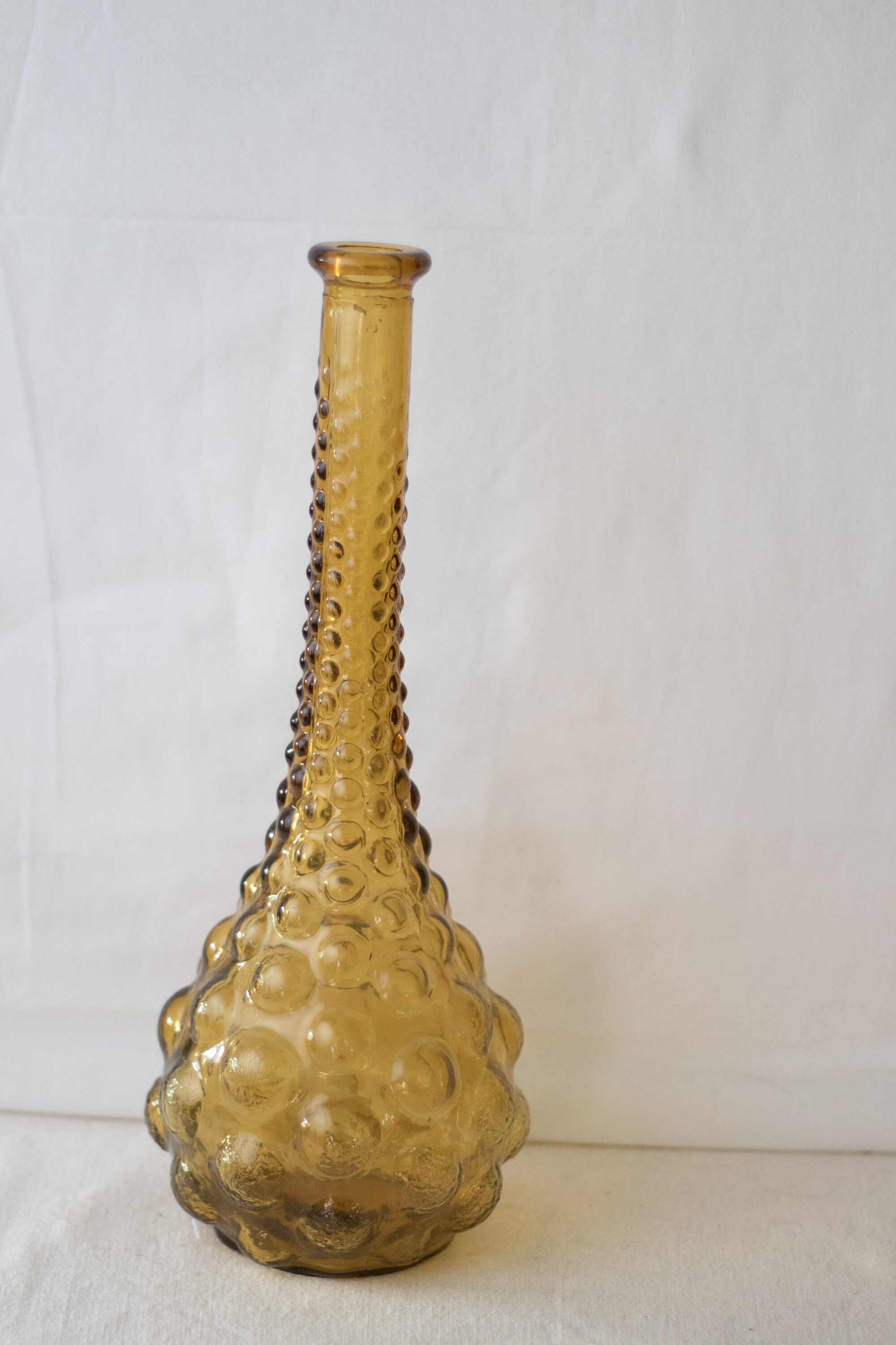 Green yellow bubble glass bottle