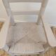 Grey patinated children's armchair with straw seat