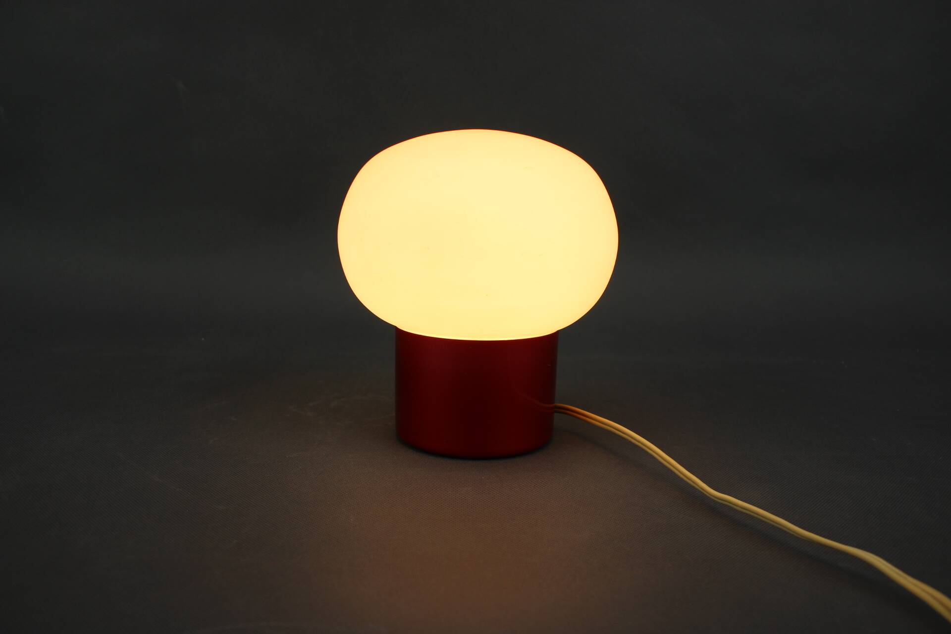 Burgundy Red opaline glass table lamp from the 1970s space age.