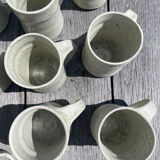 Set in stoneware cups and pitcher