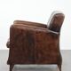 Sleekly shaped timeless design armchair made of sheepskin leather