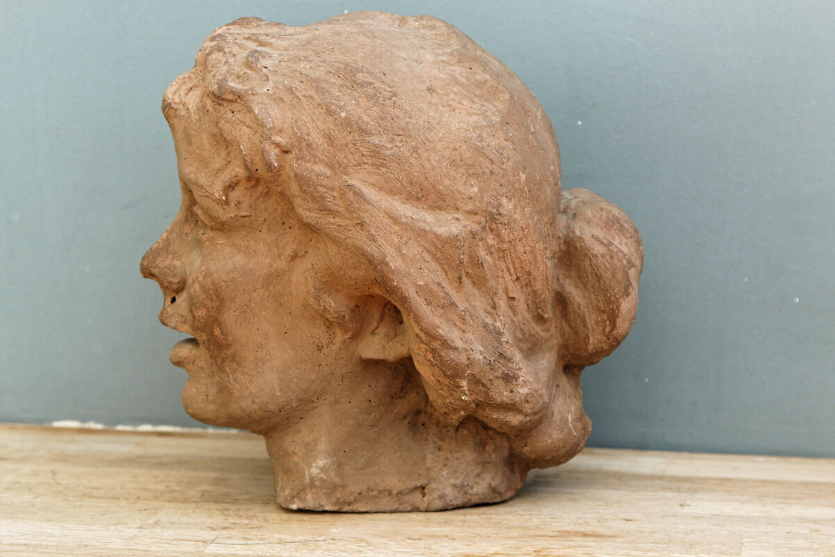 Woman's head, reconstituted stone