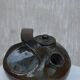 Glazed terracotta teapot