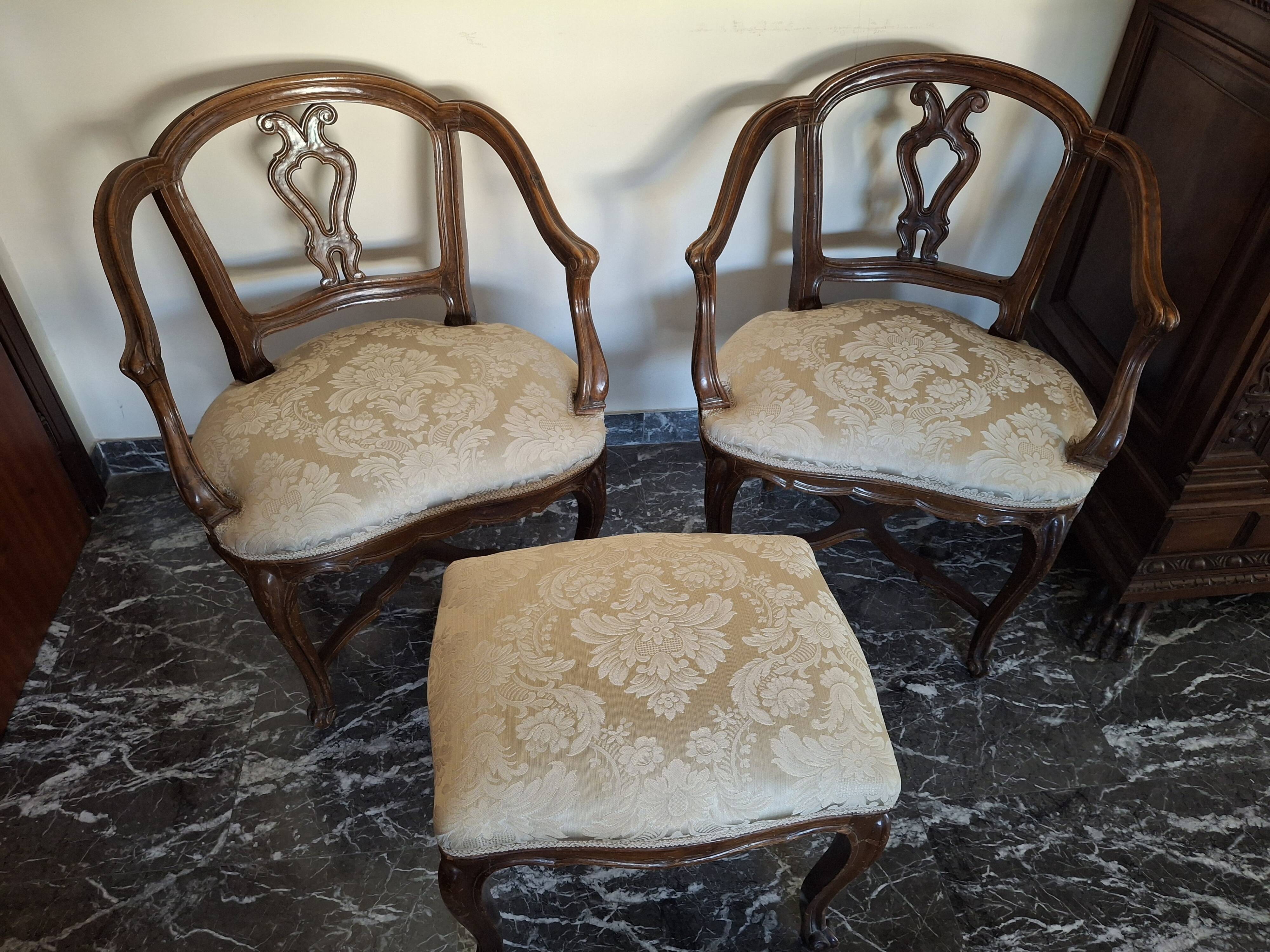 Pair of Italian armchairs from the 1960s with matching ottoman.