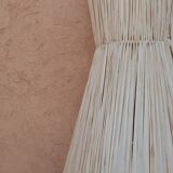 Handmade conical raffia wall light