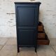 Chiffonnier en bois brut et peint en noir