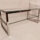 1980s coffee table with a double chrome metal top.