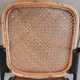 1950s chair in black metal and braided rattan