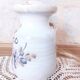 Old large vintage stoneware olive pot with its wooden spoon