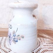 Old large vintage stoneware olive pot with its wooden spoon
