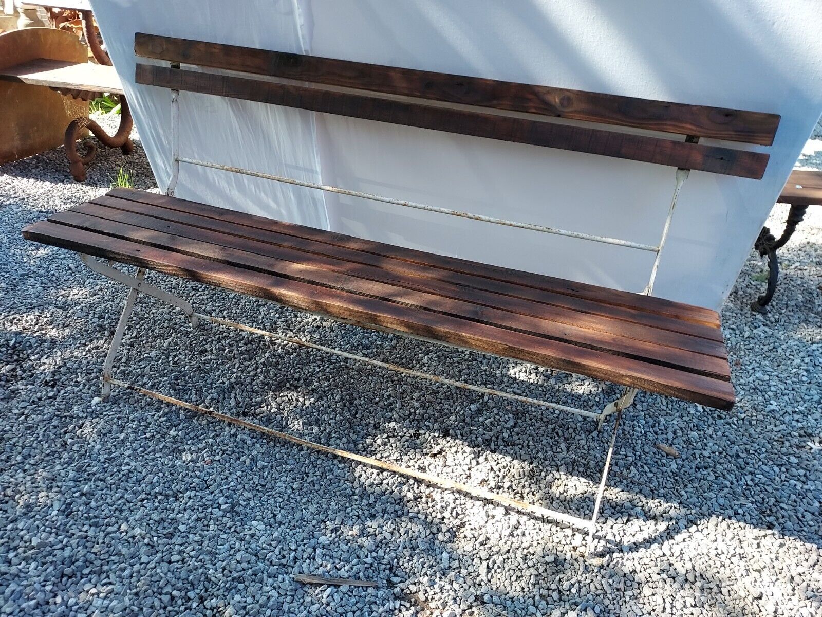 Folding garden bench in wrought iron and wood