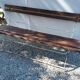 Folding garden bench in wrought iron and wood
