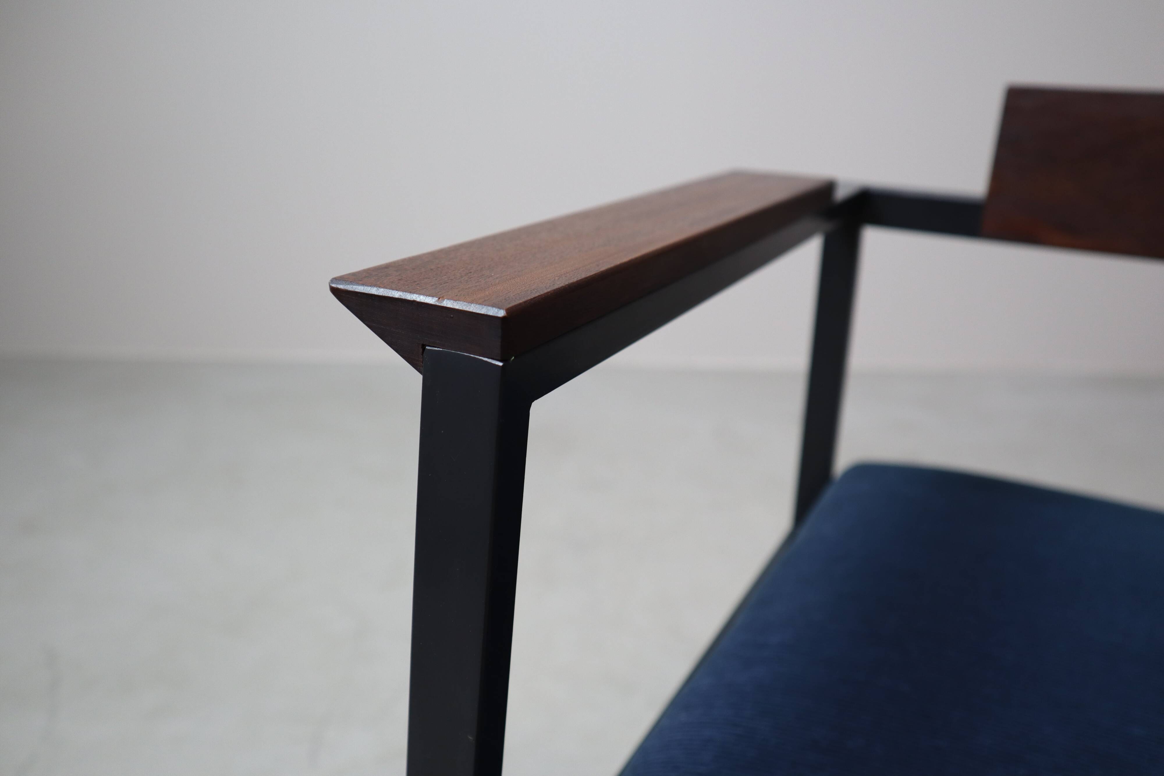 Pair of Postmodern armchairs in steel and mahogany, 1970s