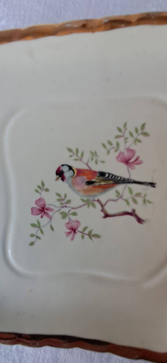 Trivet and bottle holder Salin, 1950s. Bird on branch.