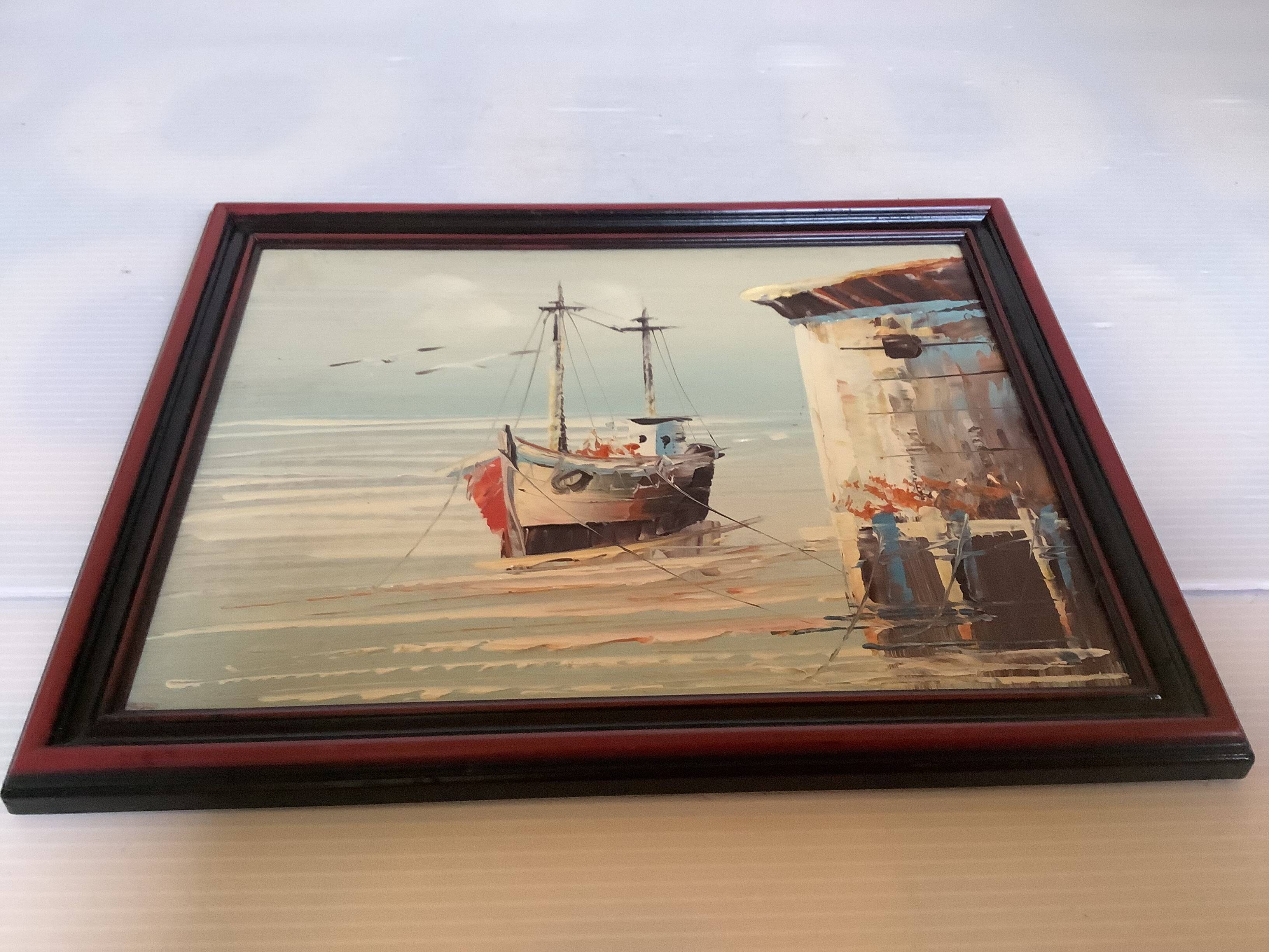 Small marine painting of a boat in oil on panel.