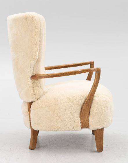 Danish armchair. upholstered with Australian lambskin. Danish Cabinmaker, 1940's