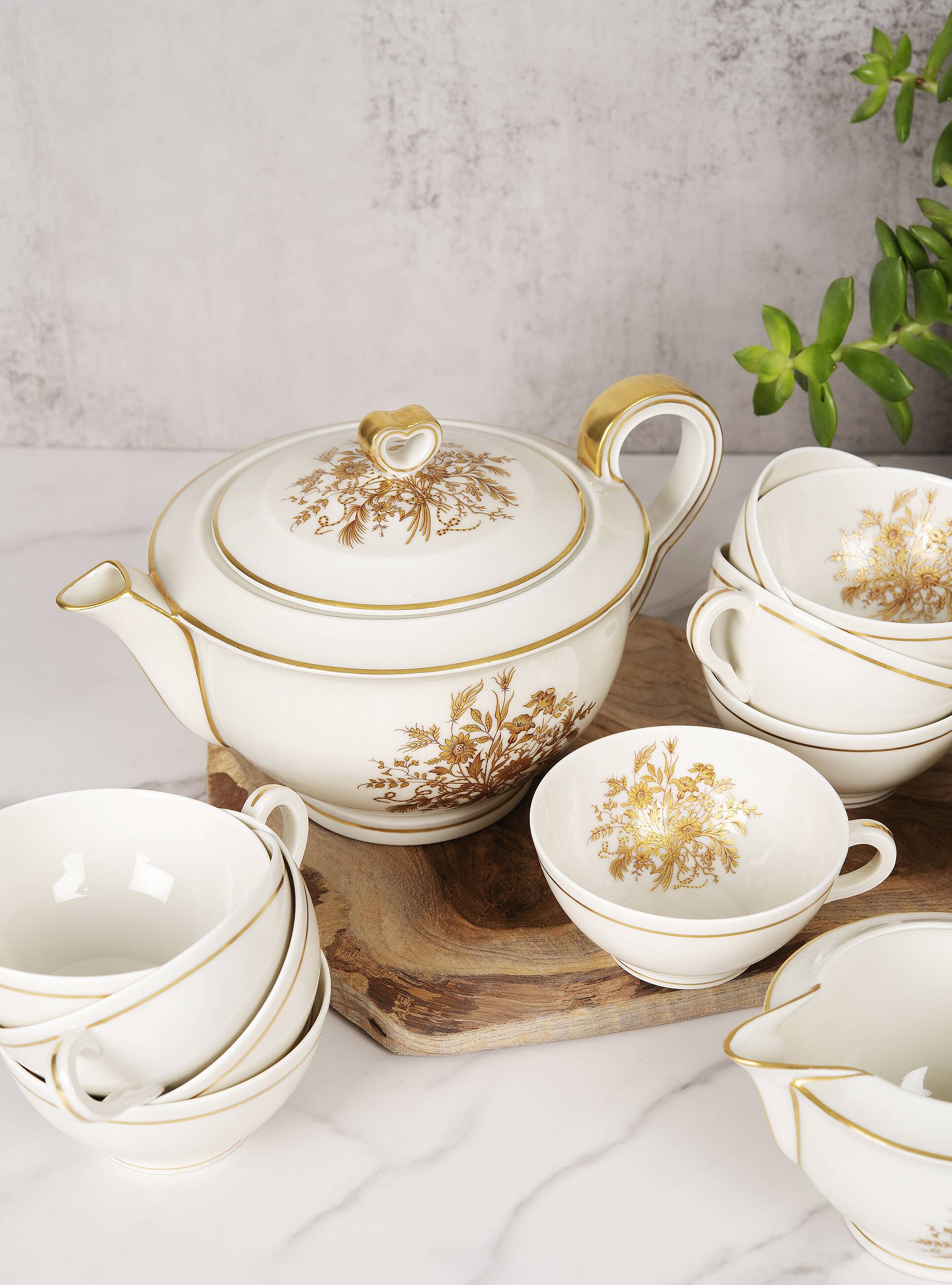 Porcelain tea service by Théodore Haviland, gilded patterns.
