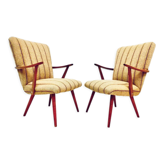A pair vintage cocktail chairs with stripes and metal screws