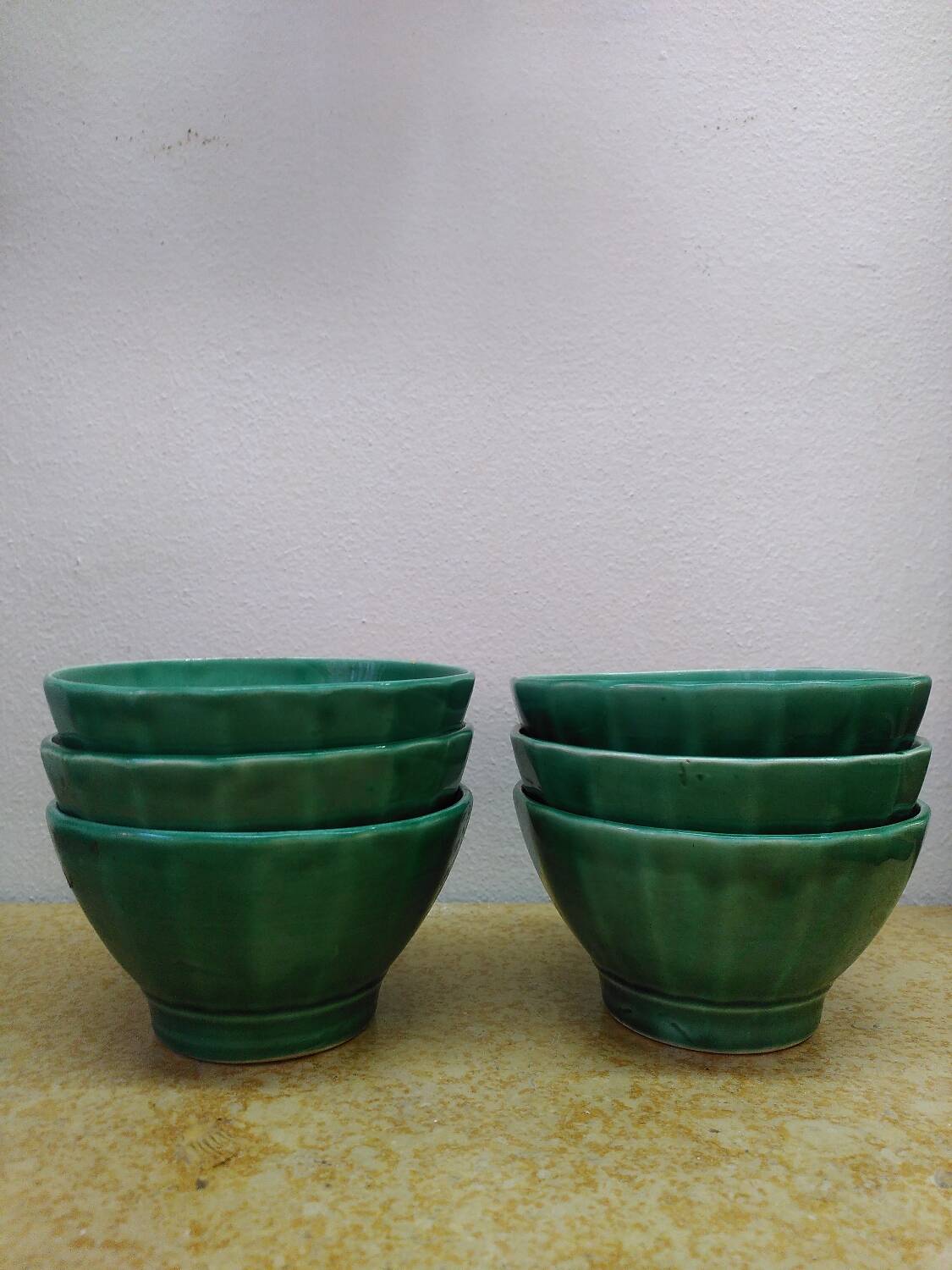 Set of 6 antique faceted ceramic bowls.
