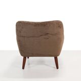 Danish design armchair in brown faux sheepskin