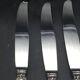 12 silver metal table knives model Rocaille