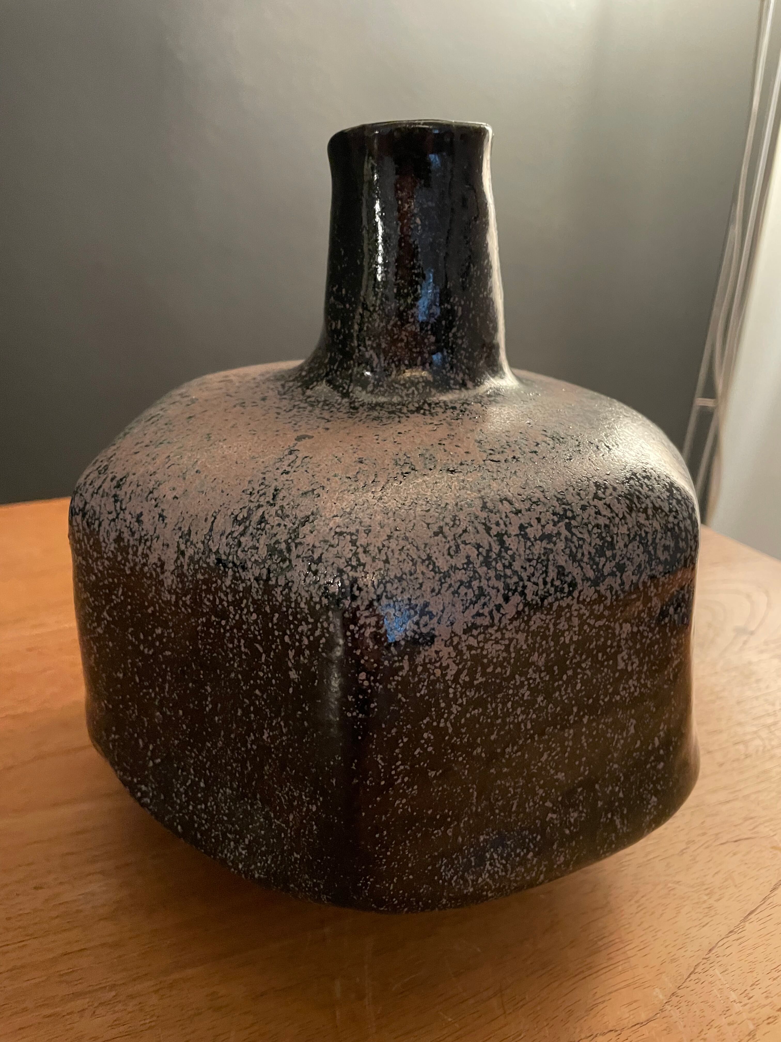 Black ceramic vase and galaxy, signed