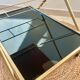 Golden dessert on wheels with black glass trays