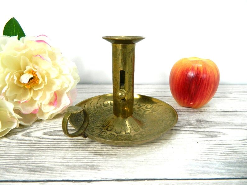 Brass candlestick with rise and fall
