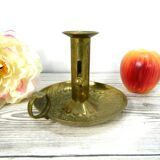 Brass candlestick with rise and fall
